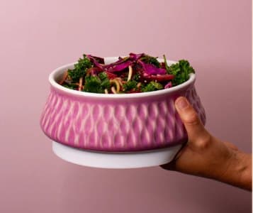 Blush Horizon Bowl held in one hand